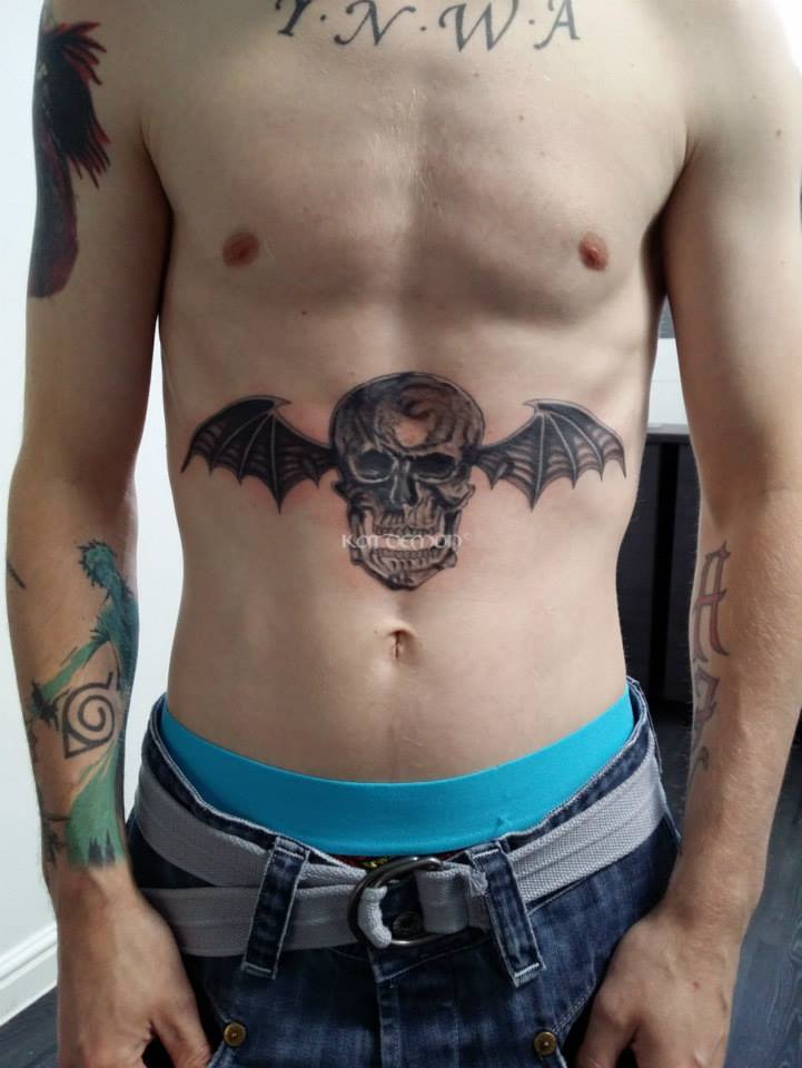 Avenged Sevenfold batwing skull on stomach tattoo